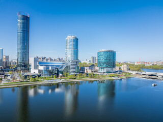 Fototapeta premium Yekaterinburg city with Buildings of Regional Government and Parliament, Dramatic Theatre, Iset Tower, Yeltsin Center, panoramic view at summer sunset.