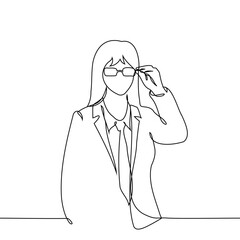 young businesswoman wearing glasses - one line art vector. concept a woman in a suit puts on or adjusts her glasses
