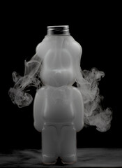 Plastic teddy bear bottle filled with swirling mist and fog creating strange effects shapes and textures