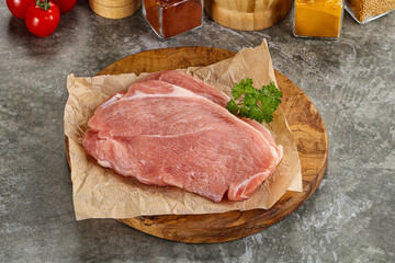 Raw pork schnitzel for cooking