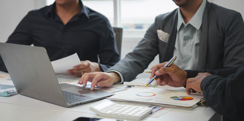 Business idea. Business people talking And calculations about charts and graphs showing the growth...