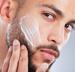 Cream, beauty and portrait of man for skincare, wellness and facial treatment on white background....