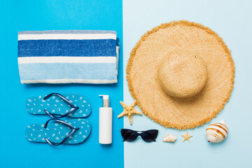Top view travel or vacation concept. Composition with stylish beach accessories on colored...