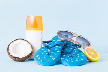 Top view composition of flip flops placed with beach accessories perspective view on table...