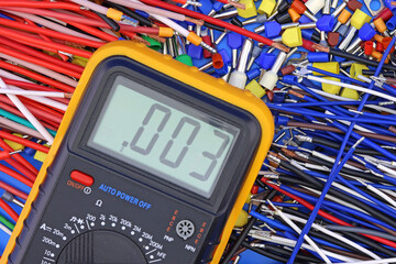 A digital multimeter for measuring the parameters of electrical circuits in an electrical diagram....