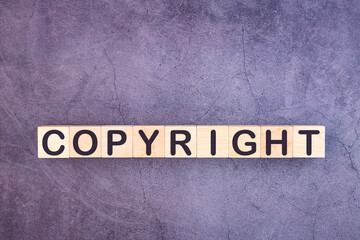 Copyright word made with building blocks on a grey background