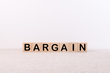 Bargain word concept written on a light table and light background