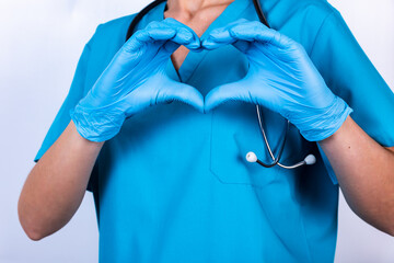 Doctor hands in gloves making heart shape