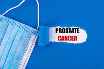 The text Prostate cancer appearing behind torn blue paper.