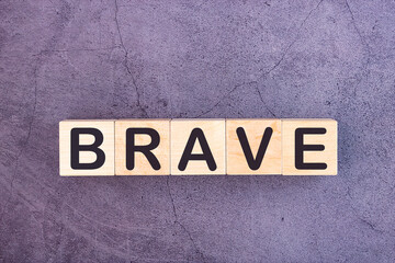 BRAVE word made with wood building blocks.