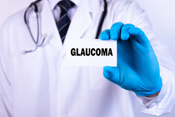 Doctor holding a card with text Glaucoma medical concept