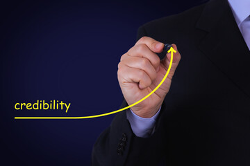 Businessman draw growing line symbolize growing Credibility