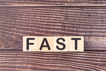 FAST word made with wooden building blocks