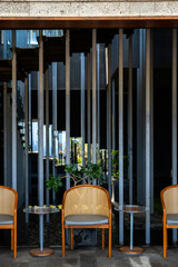 Modern Outdoor Seating with Vertical Beams in a Stylish Café