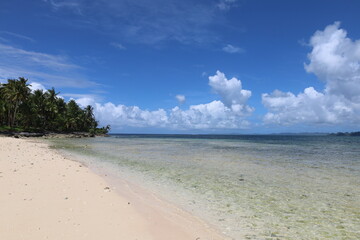 Kawhagan island view surrounded by turquoise water as a second stop of Island Hopping tour in Siargao
