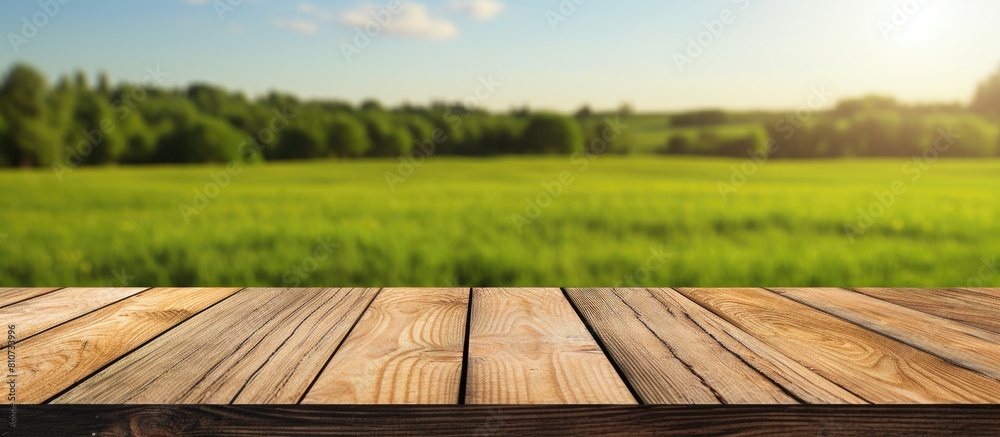 Aufkleber wooden deck table placed against a green field background creating an empty material for a product d