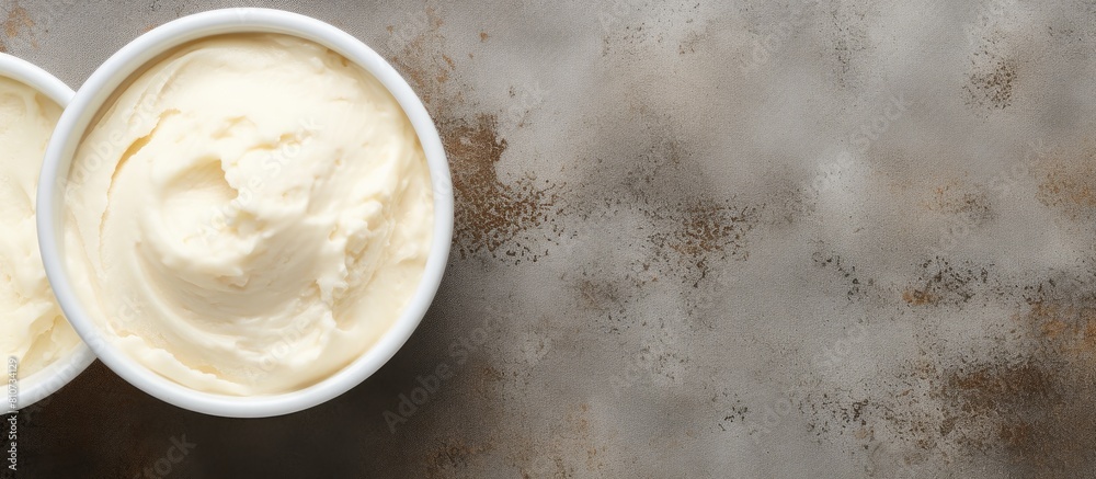 Poster A top down view of a delicious vanilla ice cream against a textured concrete backdrop leaving plenty of space for adding text or other graphic elements. Creative banner. Copyspace image