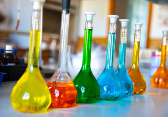 Flasks and test tubes with multi-colored chemical liquids in a laboratory in a clinic. Testing,...