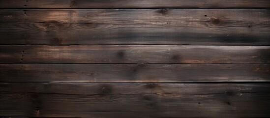 Naklejka premium A copy space image showcasing the rustic appeal of dark wood planks