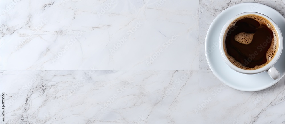 Leinwandbilder a copy space image of a coffee cup can be seen from a top view position on a marble table background