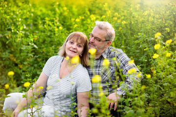 Elderly couple in blooming garden