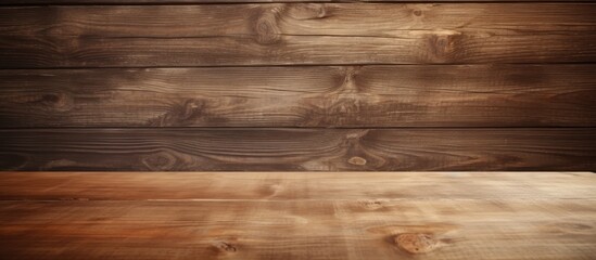 A vintage style wooden table top is placed on a wooden plank background with empty space available...