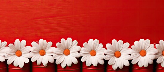 A bright red background serves as the canvas for an arrangement of wooden white barrels laid out in the shape of a Daisy flower Positioned beneath the inscription there is ample copy space in this to