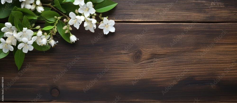 Poster A copy space image of jasmine tea adorned with fragrant jasmine flowers set against a rustic wooden background
