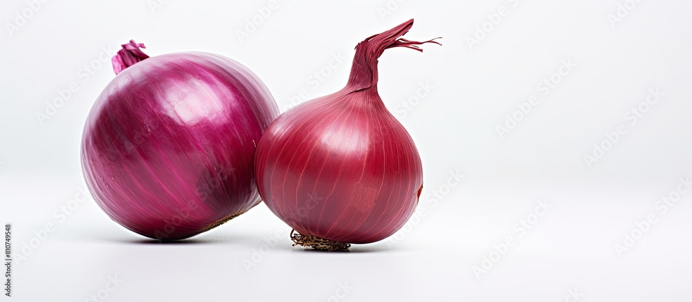 Poster A red onion stands alone on a white background in this copy space image