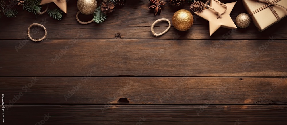 Poster Top view of a Christmas composition with presents displayed on a wooden table The image offers an empty space with papers and cardboard. Creative banner. Copyspace image