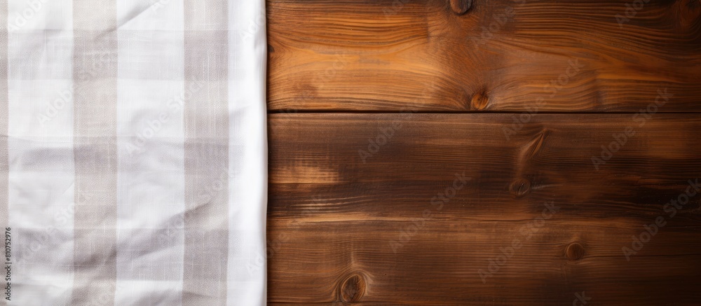 Poster A wooden background with a kitchen cloth napkin available for use and a space for additional content