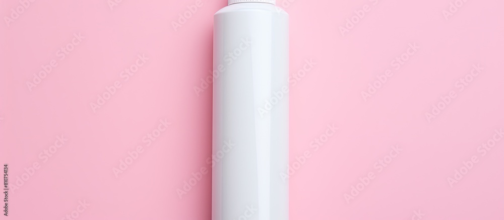 Poster a white dispenser for shampoo cream or soap is seen from a top view on a pink background with plenty