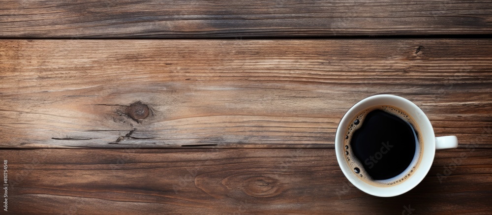 Aufkleber A top down perspective showing an old wooden surface with a cup of black coffee perfect for a copy space image 108 characters
