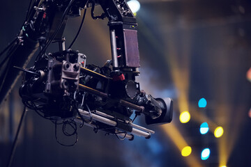 TV camera on a crane at a football match or concert. Close-up live video broadcast camera