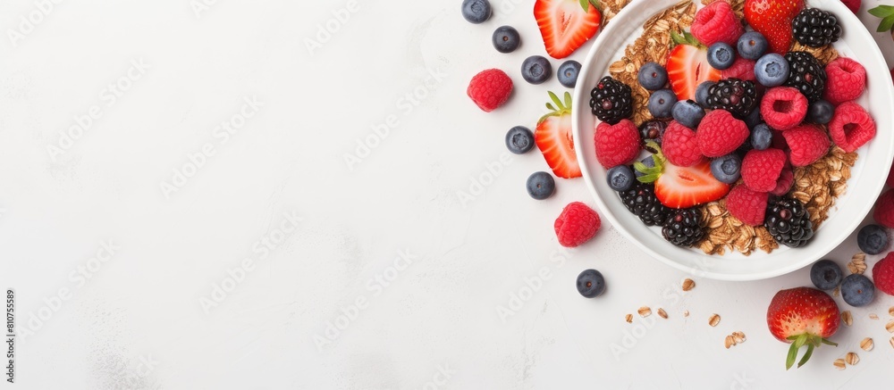 Poster An overhead shot of a healthy breakfast consisting of homemade granola topped with yogurt and fresh berries presented in a flat lay style with plenty of negative space for text or other elements