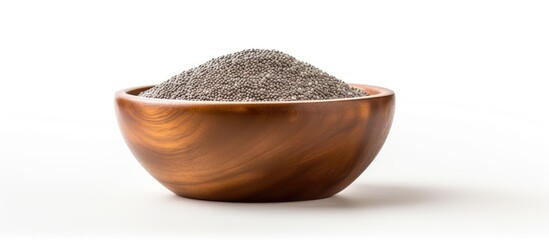 A copy space image featuring chia seeds beautifully presented in a wooden bowl set against a crisp white background