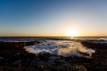 Obraz premium quiet sea coast with stones at the twilight, natural sea background.