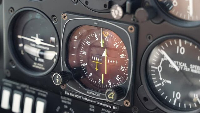 Cockpit interior of a small plane DA40, in flight. Macro view of compass and instruments