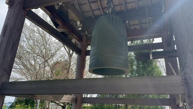 Bronze bell in wooden structure Genkō-an Temple in Japan.