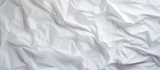 Top view of a crumpled white paper with a textured surface creating an interesting copy space image