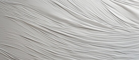 Obraz premium A detailed shot capturing the texture of a gray canvas with a white background providing ample space for text or images