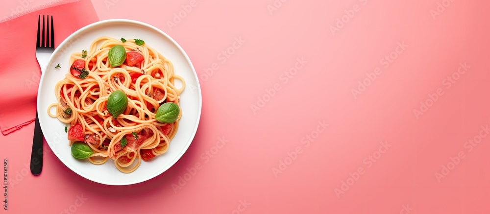 Poster delicious pasta dish with a fork fresh tomato and basil on a pink background providing ample space f