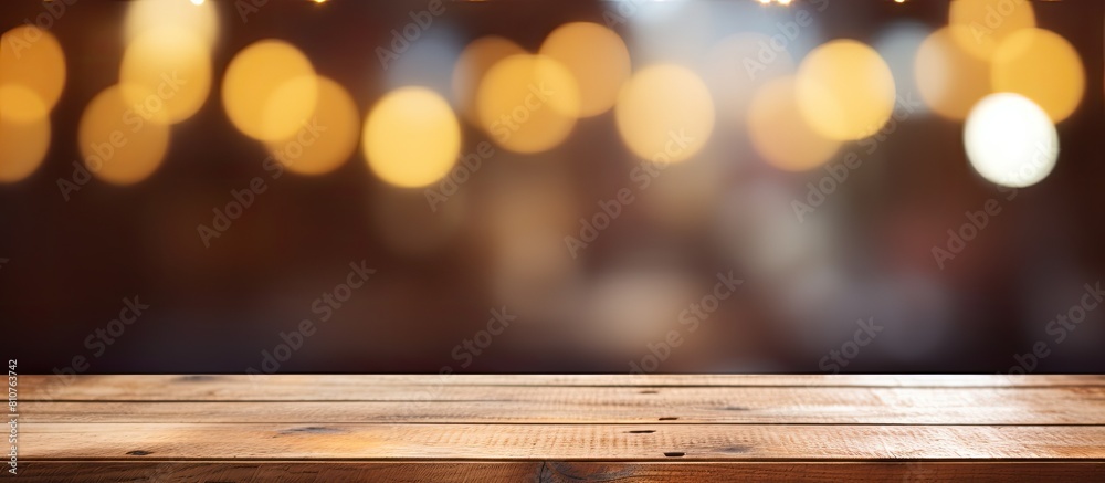 Aufkleber an empty wooden table with a blurred abstract background providing ample copy space for text marketi