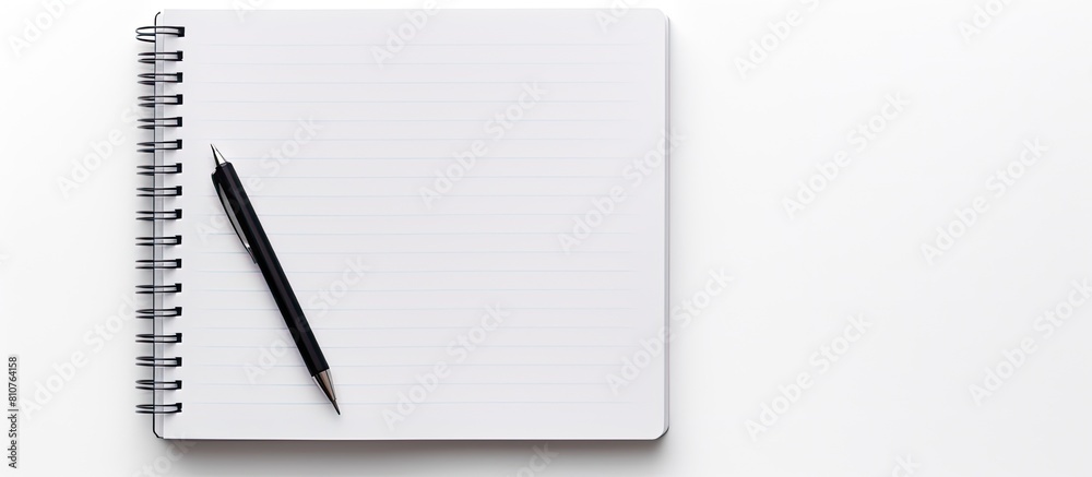 Fototapete A white background with a notebook pen or biro with empty space for use as an image. Creative banner. Copyspace image