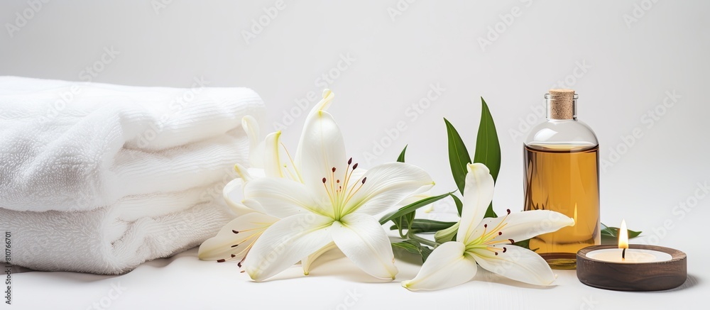 Poster A serene wellness setting showcases a beautiful lily a towel a candle and an oil bottle on a white background providing ample copy space for your own use