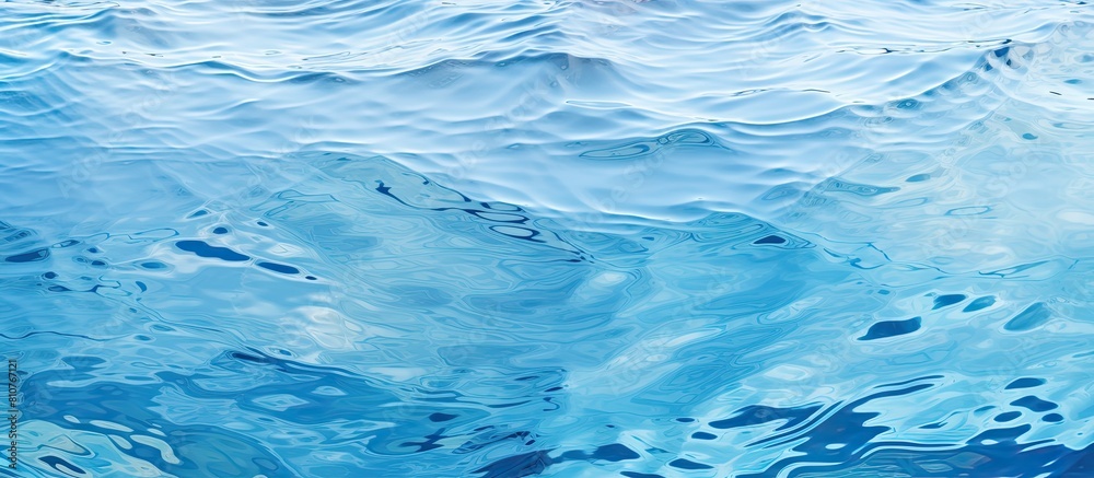 Aufkleber Top view of a clear water surface with rippling patterns set against a light blue background creating a visually appealing copy space image