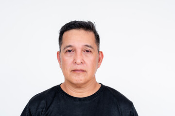 Fototapeta premium Middle aged Asian man, sober expression, white background