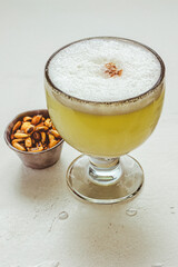 Close up of Pisco Sour cocktail, a typical drink from Peru and Chile.
