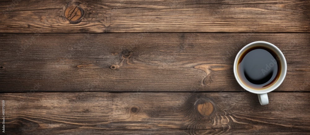 Aufkleber A top down perspective showing an old wooden surface with a cup of black coffee perfect for a copy space image 108 characters