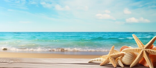 A serene summer sea backdrop adorned with starfish shells and a wooden surface provides an ideal copy space image